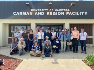 Soil judging participants and volunteers at the front entrance of the Ian N. Morrison research station